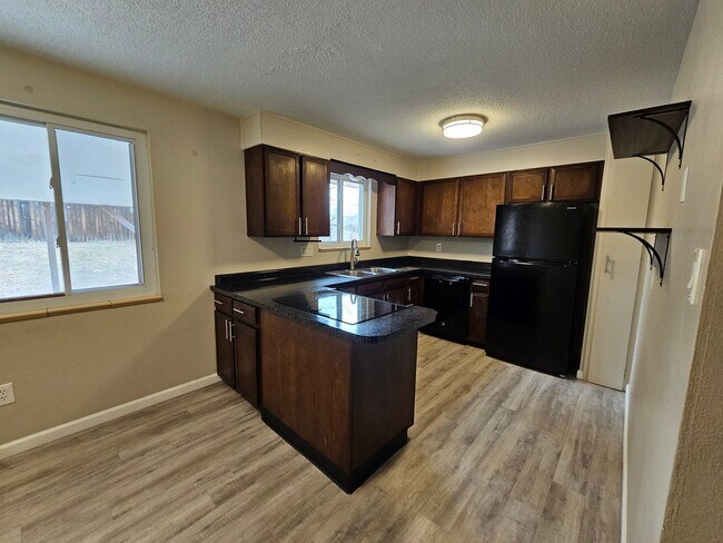 Building Photo - Welcome home to this maintained 4-bedroom, 2-bath Home in 80909!