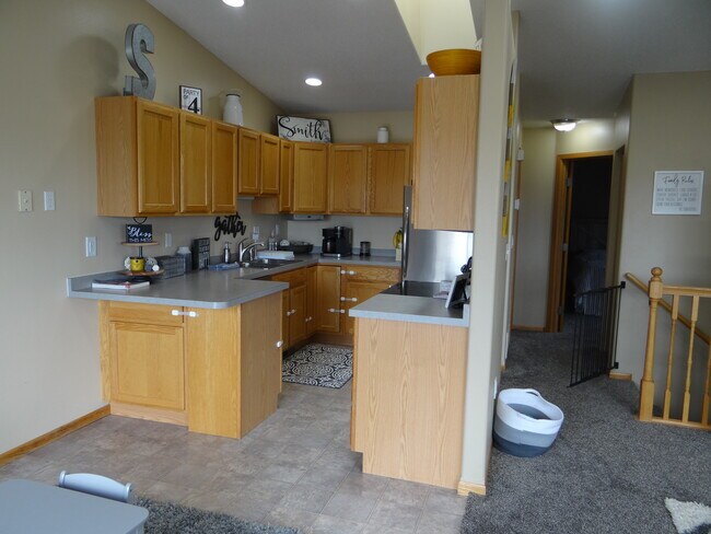 Kitchen with stainless steel appliances - 998 38 1/2 Ave W
