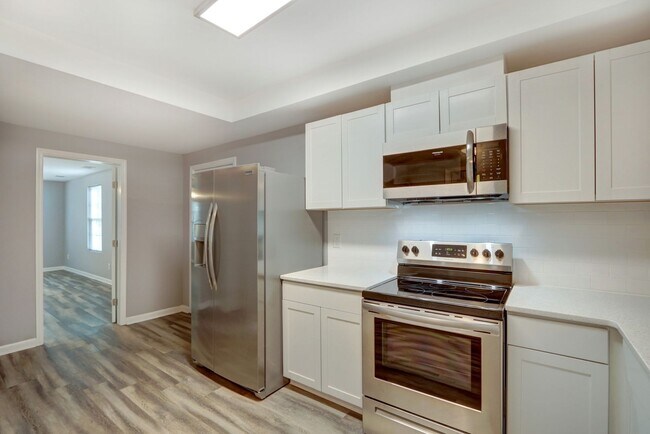 Building Photo - New Construction - Three Bedroom, Three Bathroom Home with yard & parking!