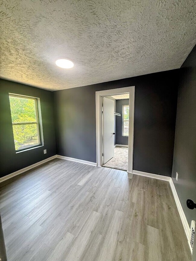 Building Photo - Three bedroom one bathroom single-family home for rent