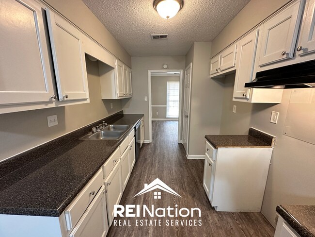 Building Photo - CORDOVA COVE CHARMER! 3BR/2BA | High Ceilings & Brick Fireplace | 2-Car Garage!