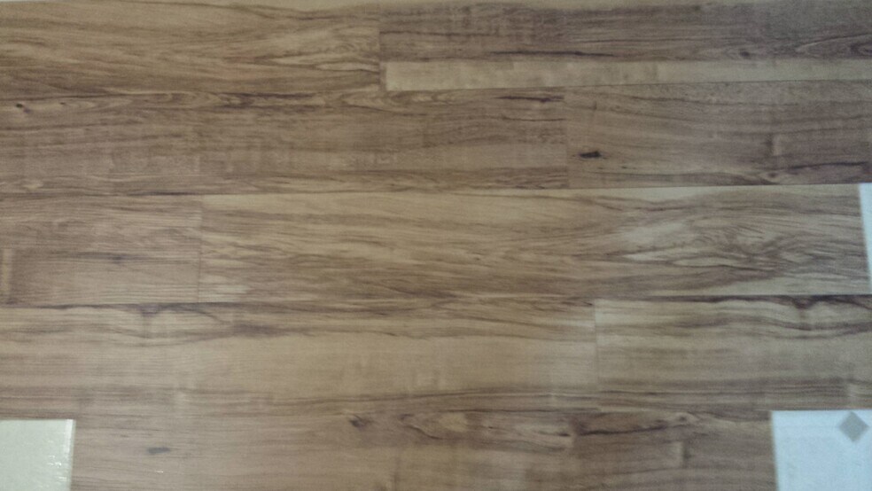 new flooring close up, this will be in kitchen and family room in basement. - 731 Crawford Dr