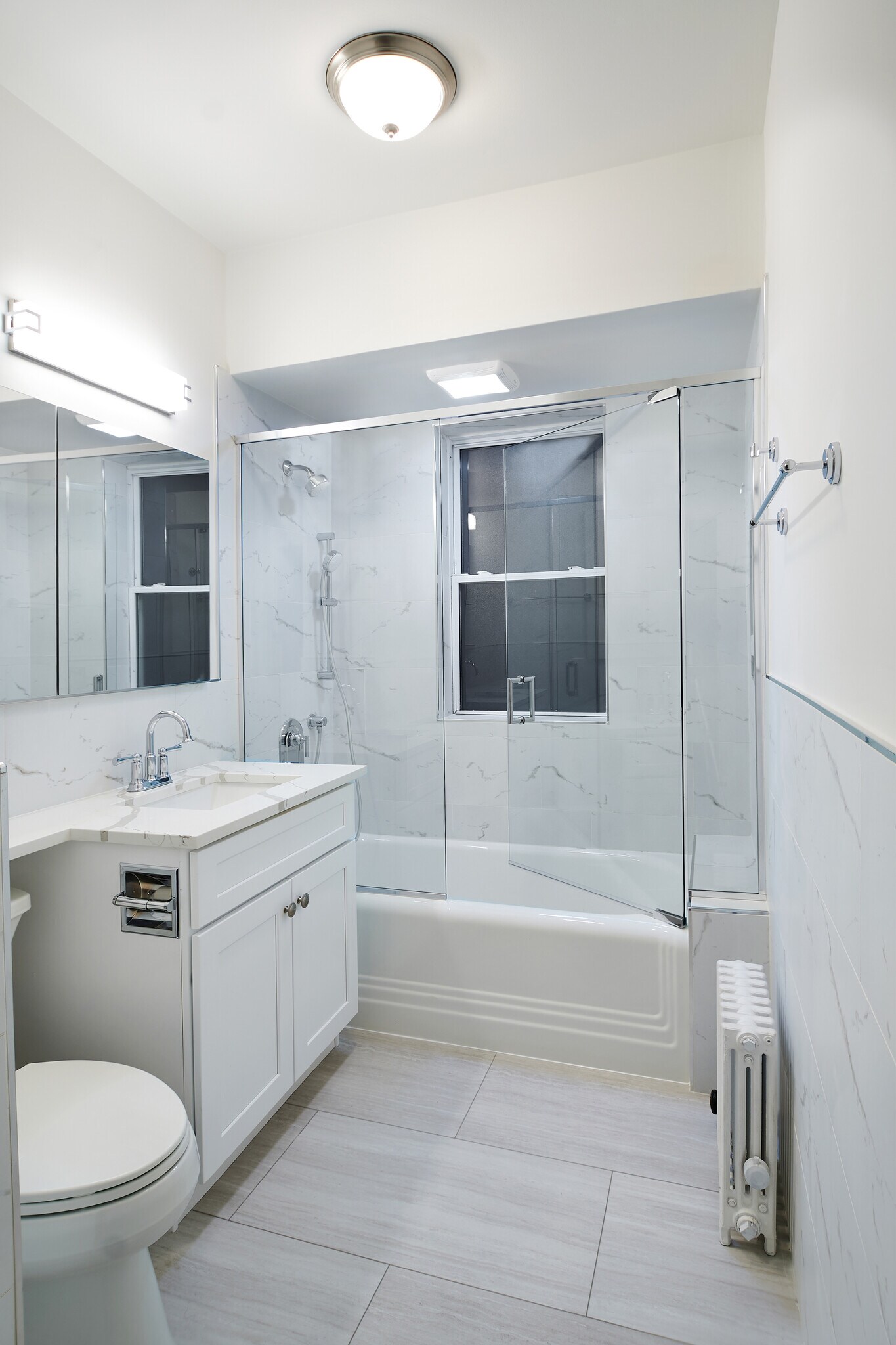 Bathroom With Quartz Counter, Tiled Walls, Glass Shower Door - 5610 N Kenmore Ave