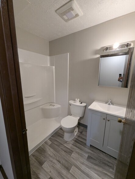 New walk-in shower, vanity flooring - 237 Summit St N