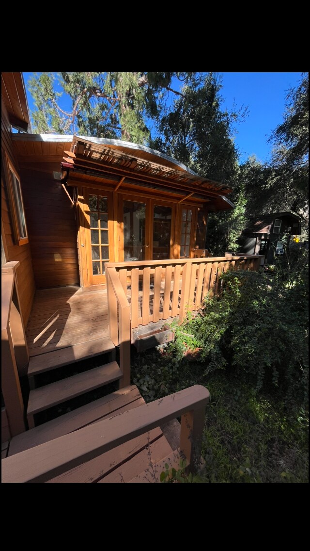 master bedroom/deck/walkway to parking on the left and small yard to the right. - 1417 Old Topanga Canyon Rd