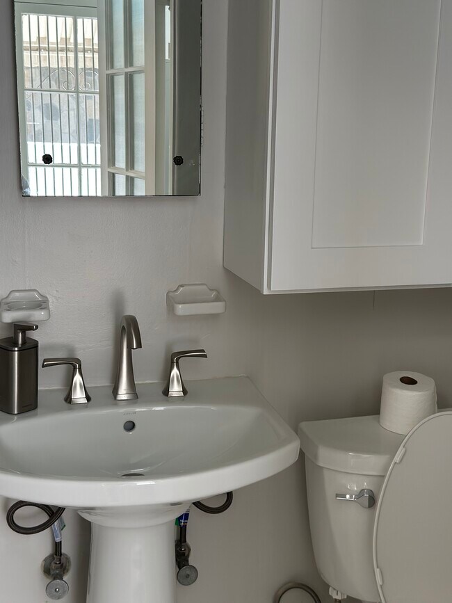 half bath off laundry room - 100 S Kings Rd