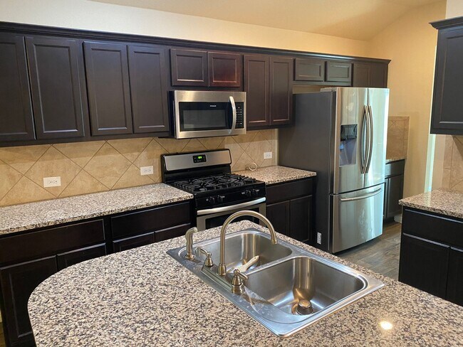 Building Photo - Three Bedroom, Two Bath, Two Car Garage, Washer and Dryer are included.