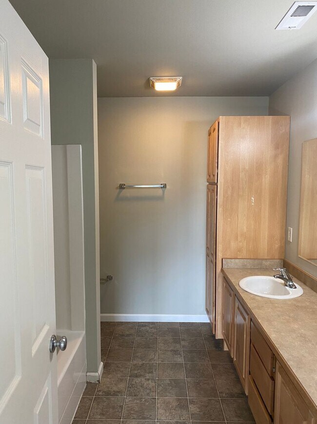 Building Photo - Spacious End Unit Condo