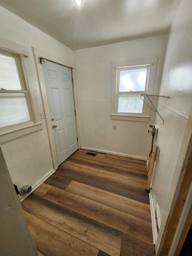 Building Photo - Nice home with oversized 2car gar with work bench and large shaded yard. Country-like setting