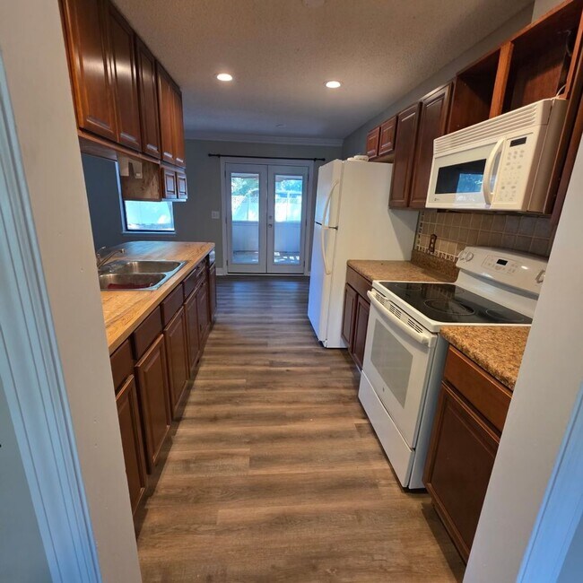 Building Photo - Corner Lot Charm: Spacious 4 Bed on Corner Lot w/ Custom Bookshelves & Private Storage Shed