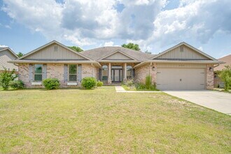 Building Photo - Milton 4BR Pool Home with Office, Vaulted Ceilings, Screened Saltwater Pool & 2-Car Garage