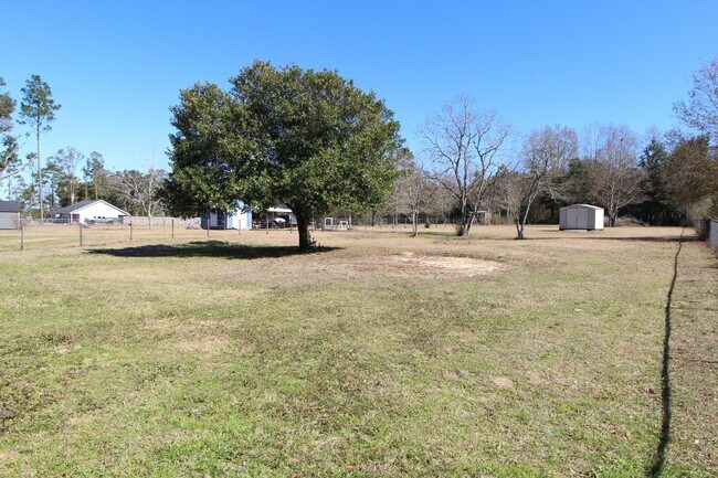 Building Photo - Charming 3-Bedroom Brick Home on Half an A...