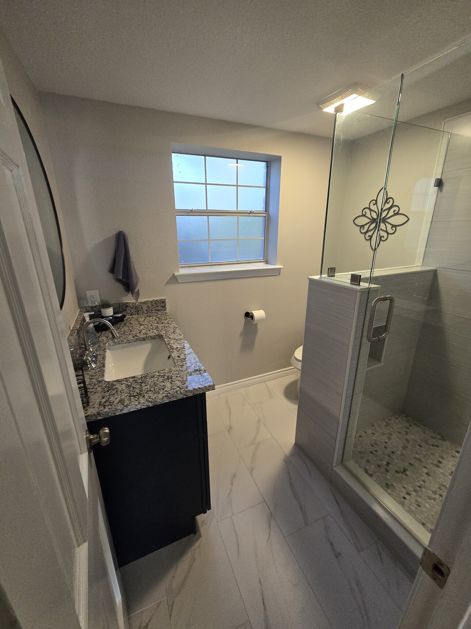 Full bathroom with walk-in rainfall shower - 2708 Pin Oak Ln