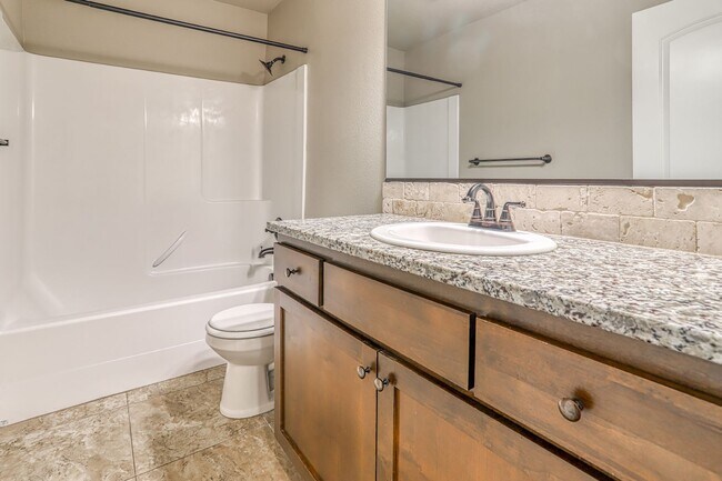 Building Photo - Centrally Located 4 Bedroom Townhome with Attached Garage & AC