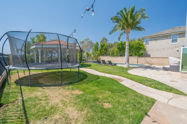 Building Photo - Spectacular 5-Bedroom Home with Pool, RV P...