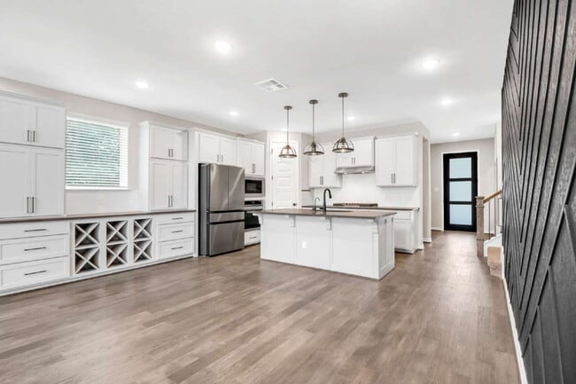 Building Photo - "Spacious 4-Bedroom Sanctuary with Cozy Fireplace in San Antonio's Prime Location!"