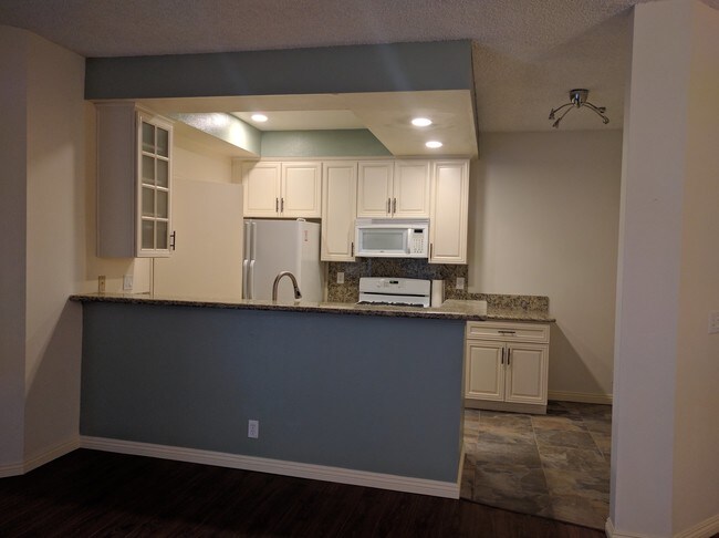 Kitchen view from living room - 10021 Tabor St