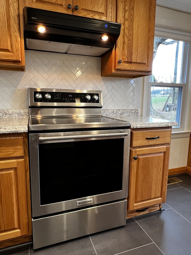 New appliances and herringbone tile backsplash - 633 Little Britain Rd N