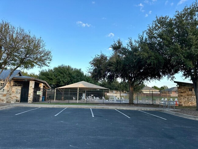 Building Photo - For Lease – Modern 2023 Condo Backing to Greenbelt | Creekside at Pioneer Crossing West