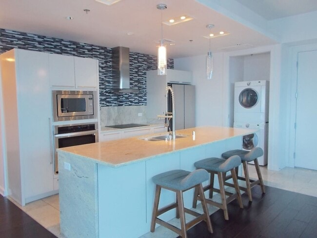 Building Photo - Experience elevated high-rise living at The Martin.