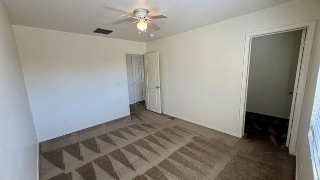 Building Photo - Two Story Home with NEW tile and a large backyard!