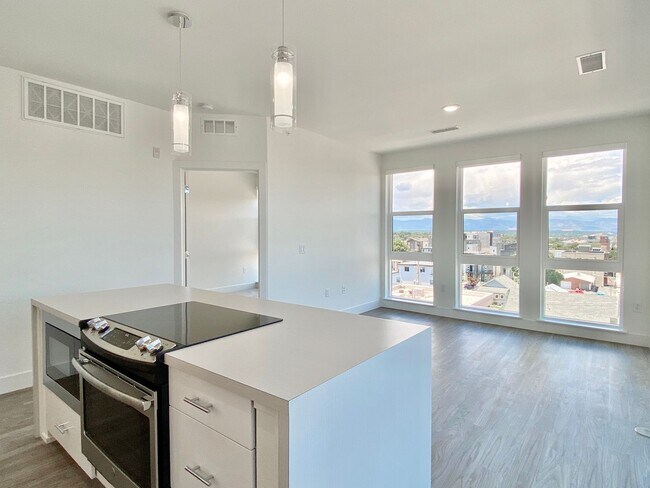 Building Photo - Luxury Top-Floor Condo with Stunning Mountain & City Views