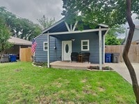 Building Photo - Front Porch Charm & Backyard Dreams!