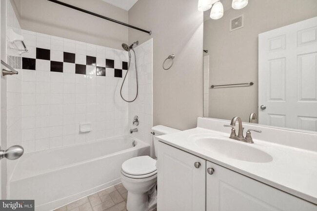 Building Photo - This townhouse style condo is located across the street from the Vienna Metro Station (Orange Line).
