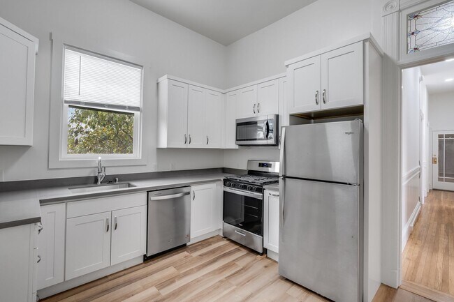 Building Photo - Remodeled pet friendly, top floor 2BR with in-unit laundry