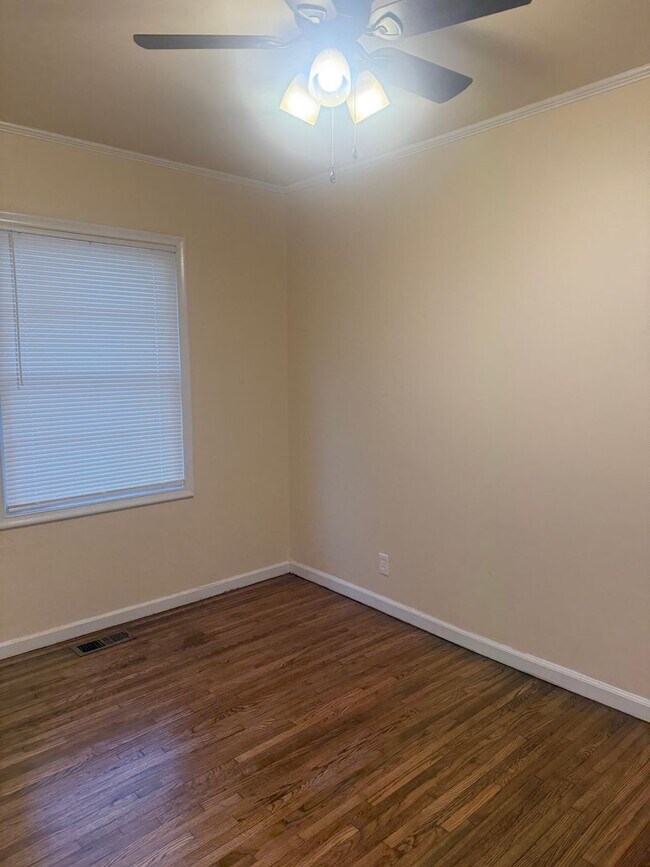 Building Photo - Step into this beautifully updated 1950's gem, where charm meets modern convenience