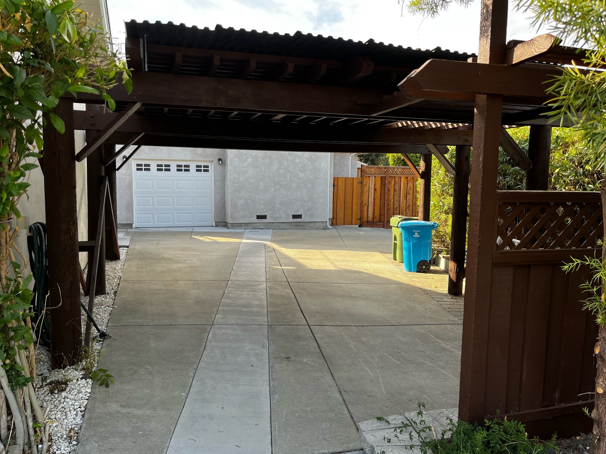 Single car garage with car port in front and the front view of the house, fenced - 3120 Mauricia Ave