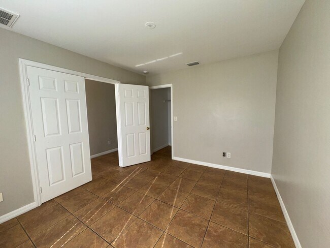 Building Photo - Experience this Cape Coral 3 bedroom 2 bath corner duplex with 1 car garage and screened in lanai.