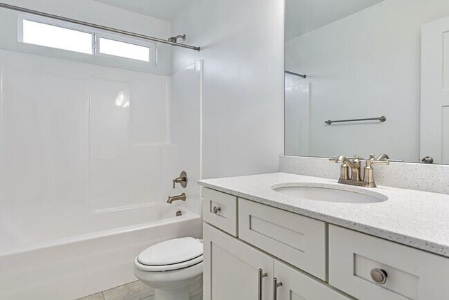 Building Photo - ROW END TOWNHOUSE W 2 CAR GARAGE + AMENITIES