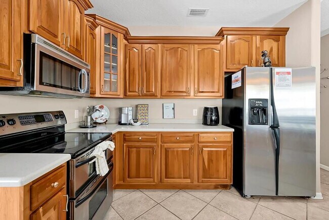 Building Photo - "Stunning 3BR Orlando Home with Private Screened Pool, Spa & Spacious Living Areas"