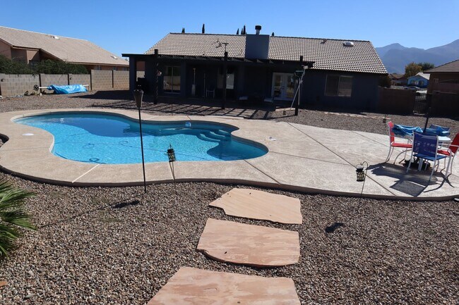 Building Photo - Home With A Pool and Much More!