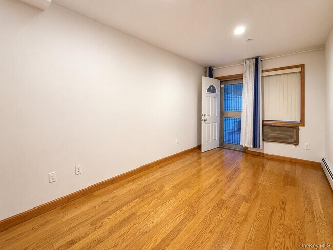 Building Photo - 65-44 Woodside Ave