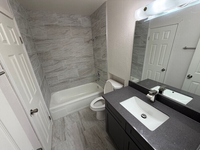 Building Photo - BEAUTIFULLY RENOVATED 3/2/2 CAR WITH DEN