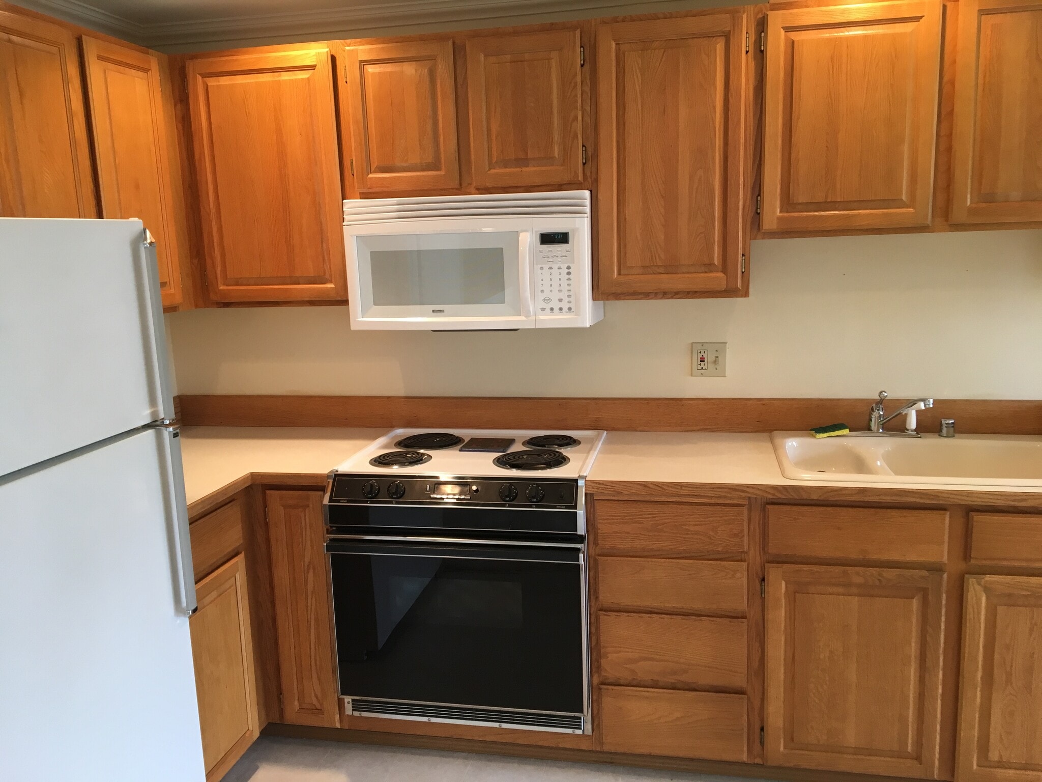 Solid oak cabinets; range, fridge, microwave, new dishwasher, good counter space, plenty of storage - 610 Glen St