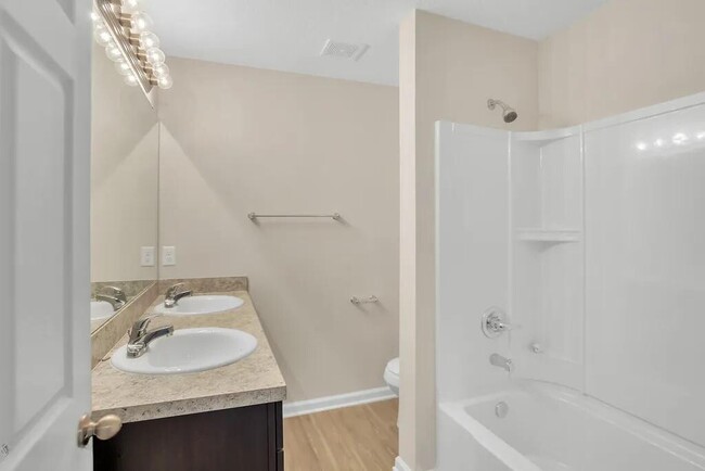 Master bathroom w/ a large walk-in closet on the left. - 9081 India Ave