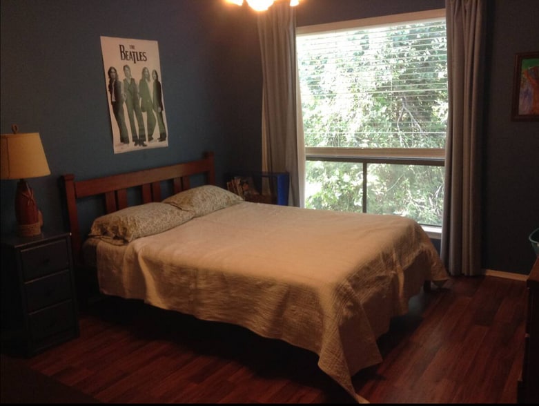 2nd upstairs bedroom has beautiful view of trees and dry creek. Now painted a neutral color. - 6806 Thorncliffe Dr