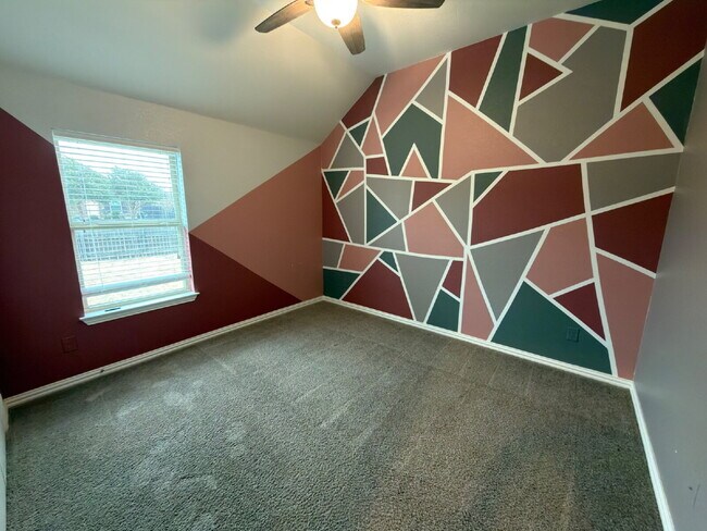 Building Photo - Four bed two bath on a corner lot with a pool in Sunfield. Gas cook top, double ovens. Open kitch...