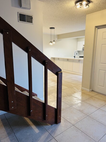 View from Living Room to Kitchen and Dining - 200 S Banana River Blvd