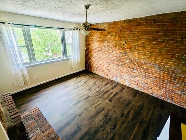 Bedroom w/ new LVP throughout - 1619 Mansfield St