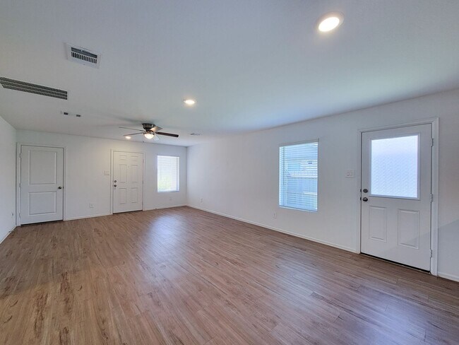 Building Photo - This single-story home has a comfortable layout with three bedrooms and a living area all on one ...