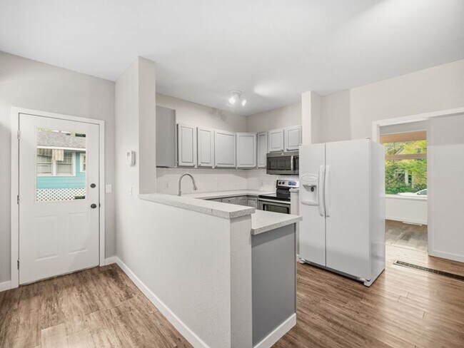 Building Photo - Stunning Updated Home in North Spokane | Bright Interiors, Modern Kitchen & Private Patio