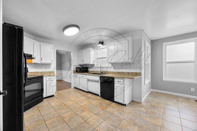 Building Photo - Four Bedroom Two Story with Two Car Garage...