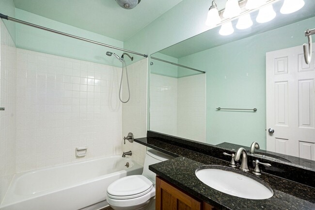 Building Photo - Spacious 4-Bedroom Home in District 20 with Huge Deck & Fenced Yard