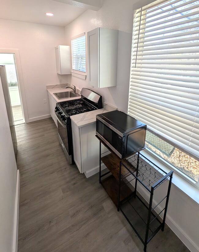 Kitchen includes oven, disposal, microwave and refrigerator - 407 Ripley Ave