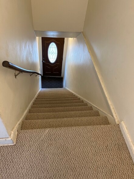carpeted staircase entrance - 217 N Franklin St