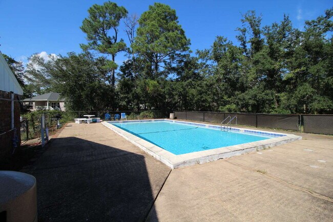 Building Photo - 2-Bedroom Waterfront Townhouse with Community Pool – Available 11/26